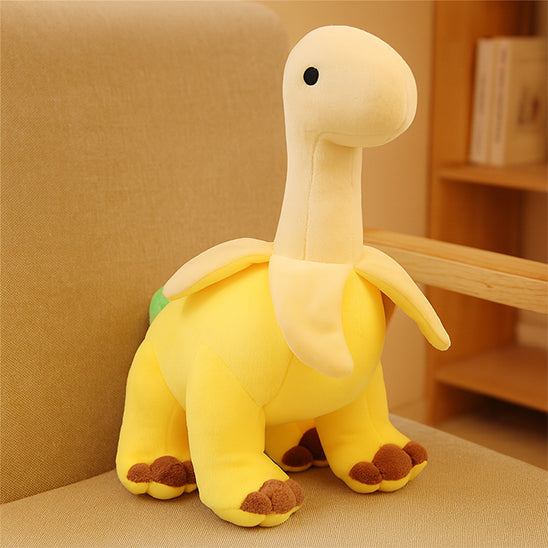 peluche dinosaure jaune sur table