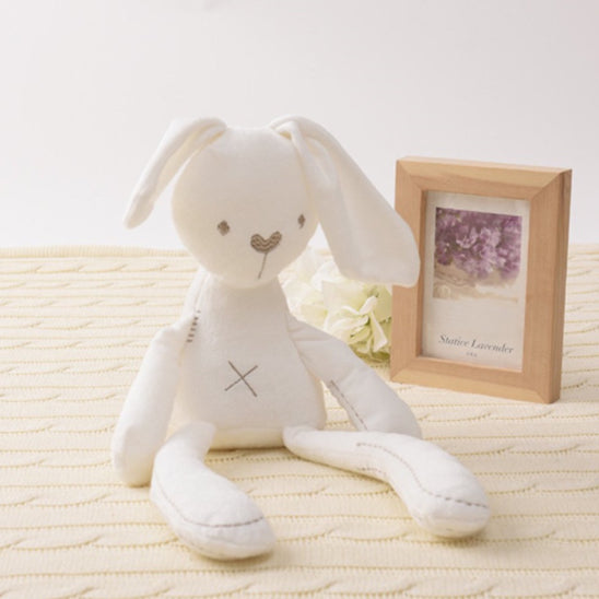Doudou lapin poupée lapin blanc assis cadre photo